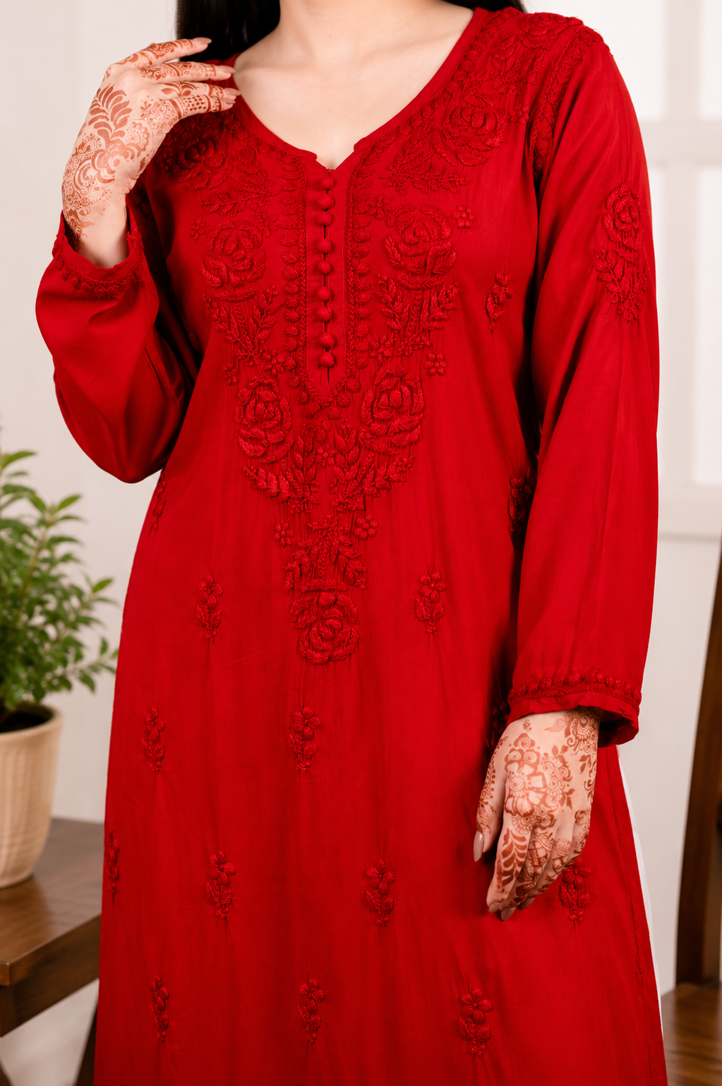 Red embroidered Modal Kurta dress worn by a person