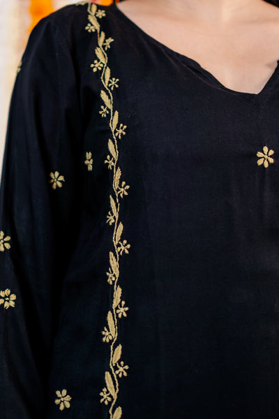 Black garment with gold embroidery details